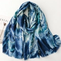 Detail of artistic gold wave pattern and soft fringe on gradient cotton linen scarf - Blue