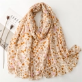 Lightweight cotton-linen feel scarf featuring multi-colored heart prints on a flat lay - Khaki