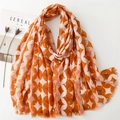 Linen feel scarf with gold foil geometric wave pattern and fringe in orange and pink - 180x88 / Orange