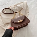 Dark brown matte leather crossbody bag with golden cylindrical clasp and chain strap - Brown