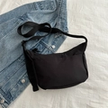 Minimalist black nylon crossbody bag with adjustable wide strap for daily casual wear - Black