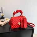 Red quilted small square bag with golden heart lock and chic cloud-shaped handle - Red