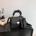 Chic black quilted crossbody bag with golden heart buckle and matching small pouch - Black