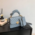 Light blue pleated handbag with V-quilt pattern and gold heart buckle in variant set - Blue