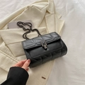 Classic black quilted shoulder bag with dark metal chain strap and sleek lock closure - Black