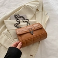 Brown quilted crossbody chain bag with metal lock buckle and square silhouette - Brown