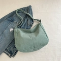 Light green corduroy hobo bag with adjustable strap and cute white charm detail - Dark Green