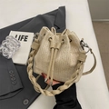 Beige straw bucket bag with V-shaped weave pattern and drawstring closure for summer beach - Khaki (Without Charm)