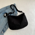Chic black corduroy hobo bag for women with decorative metallic brand pendant detail - Black