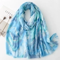 Detail of blue mountain pattern scarf featuring gold heart foil and frayed edges - 180*88cm / Blue