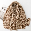Classic leopard print scarf with gold foil accents and fringe trim on white background - Khaki