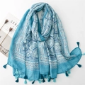 Detailed flat lay of a blue floral linen scarf with fringe, magazine and dried flowers - 180*88cm / Blue