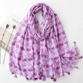 Close-up of lightweight purple scarf with fan-shaped patterns and tassel fringe detail - Purple