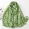 Light green leopard print linen-feel scarf with tassel edges and chic gold foil details - Green