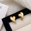 Detailed close-up of matte gold heart earrings with 925 silver needles on black velvet - Gold(A-1062)