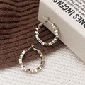 Boucles d'oreilles créoles géométriques en argent sur un fond en maille texturée - Or Café (A-1124-Or Café-2.5cm)