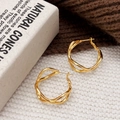 Elegant gold hollow twisted hoop earrings with irregular geometric winding design for women - Gold