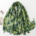 Green floral cotton linen scarf with elegant tassel trim in a stylish long wrap style - Green