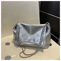 Detail of silver metallic soft leather shoulder bag with chain straps and fashion text - Silver