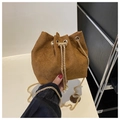 Detail of dark brown corduroy bucket bag with gold chain strap and pearl drawstring - Brown