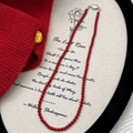 Elegant red beaded pearl necklace with silver clasp styled on aesthetic literary prop - Red 4mm (B-232-4mm)