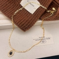 Elegante goldene Figaro-Halskette mit ovalem schwarzem Steinanhänger in warmer Optik - Gold Schwarzer Achat