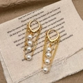 Vintage gold pearl tassel drop earrings with elegant fringe design on rustic fabric - Pearl Tassel Style (A-1149)