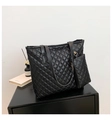 Detail of black quilted tote bag set with matching pouch and premium matte finish - Black