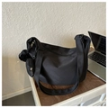 Detail of black canvas tote bag with small pouch and plush ball on wooden table - With Pendant / Black