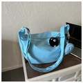 Macro shot of light blue crescent canvas bag fabric with soot sprite plush pendant - With Pendant / Blue