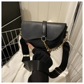 Detail view of black saddle bag with golden chain and adjustable wide nylon strap - Black