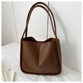 Detailed side view of a brown faux leather tote bag with U-shaped stitching and dual handles - No Pendant / Coffee