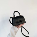 Borsa a mano nera minimalista con trama litchi e profilo trapezoidale distintivo - Nero