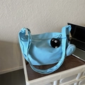 Sky blue canvas crescent crossbody bag with mini pouch and coal sprite charm accessory - With Pendant / Blue