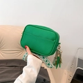 Green lychee grain leather crossbody bag with wide geometric strap and fringe detail - Green