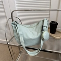 Mint green nylon crescent crossbody bag with a round mini coin purse and quilted texture - No Pendant / Green
