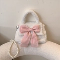 White plush handbag with a large pink organza bow and a long elegant pearl shoulder strap - White