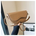 Detail of caramel vintage saddle bag with matte synthetic leather and gold hardware - Brown