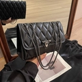 Quilted black crossbody bag with metal chain strap and twist lock closure for women - Black