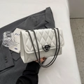White quilted crossbody bag with dark metal chain strap and twist lock closure - White
