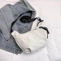 Minimalist white half-moon crossbody bag with adjustable black strap and rope zipper - White