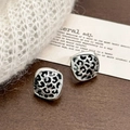 Retro square silver earrings with black leopard enamel pattern on a rustic wooden desk - Square Studs / Silver Leopard Print