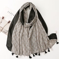 Linen-feel cotton shawl with geometric print, fringe tassels, and black contrast border - Black