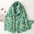 Detail of green leopard print scarf with gold foil accents and natural frayed edges - 180*85CM / Green