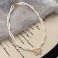 Double-layered pearl necklace with a gold-plated butterfly zircon pendant and adjustable chain - Gold White Pearl (High Luster)