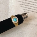 Close-up of bohemian gold plated ring with turquoise stone and zircon details - Gold Turquoise