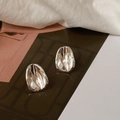 Macro shot of polished irregular concave oval earrings with shiny silver metallic finish - Small / Earring Post / Silver