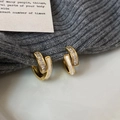 Gold plated geometric hoop earrings with cubic zirconia and white enamel on a cozy knit background - White Shell Style (A-1165-White Shell)