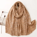 Brown and white cotton linen scarf with leaf patterns and fringe on minimalist background - Brown