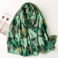 Green cotton-linen scarf with gold ginkgo leaf pattern and soft tassel edges - Green